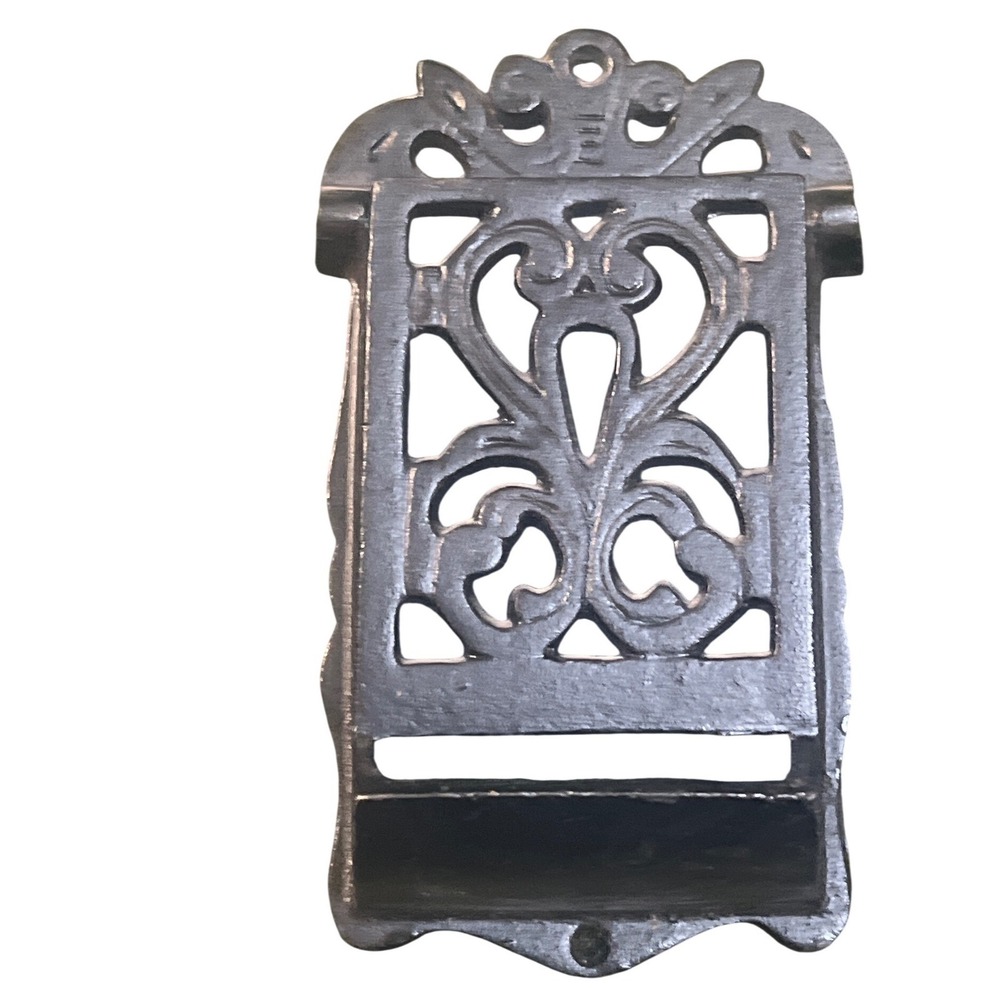 vintage Victorian-style cast iron wall-mounted match holder ornate scrollwork